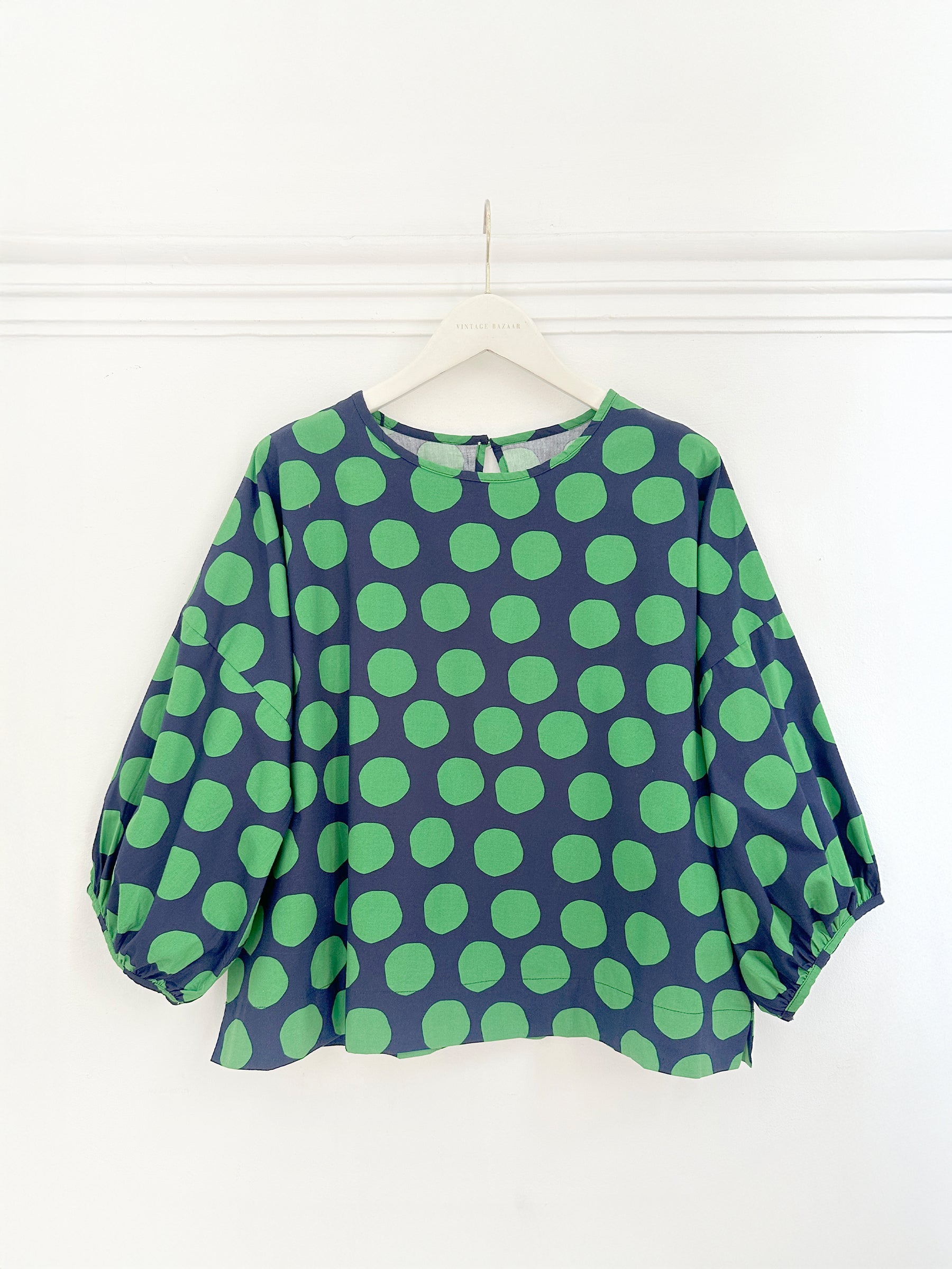 Blusa de bolas