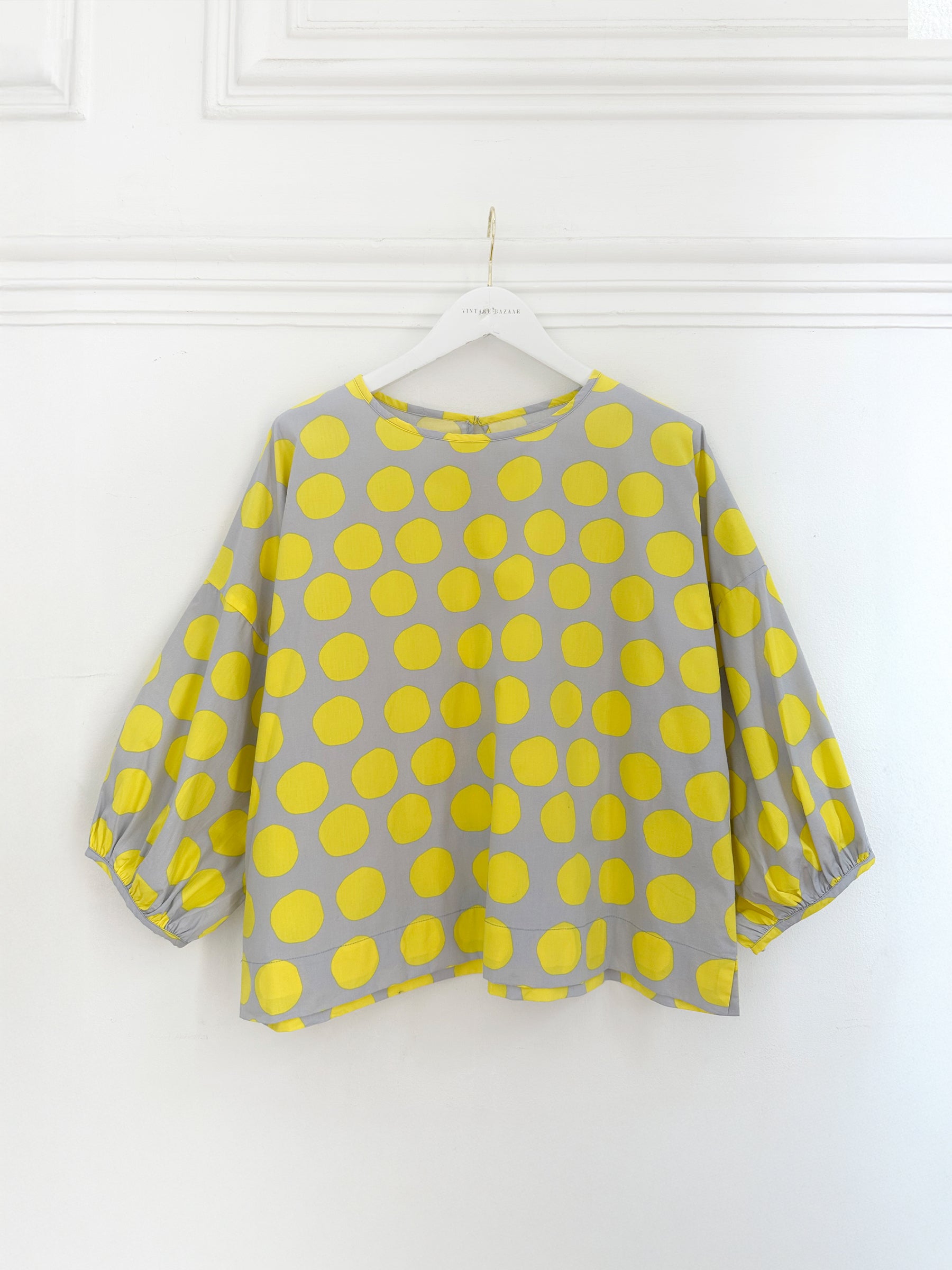 Blusa de bolas